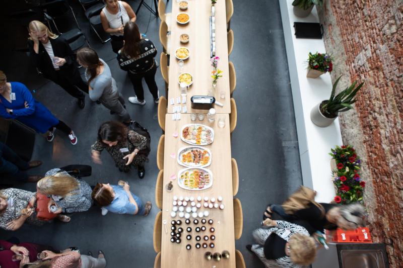 Guests around a long table seen from above at Women in Leadership
